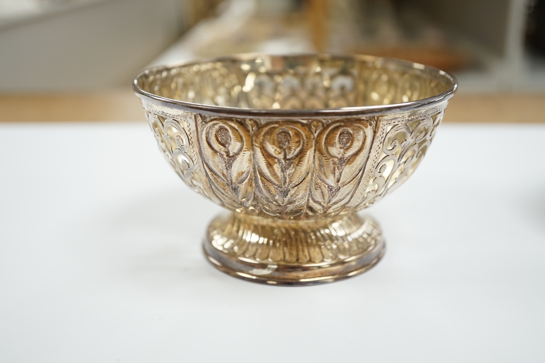 An Edwardian Arts & Crafts silver single handle two division dish, by Charles Edwards, London, 1904, 16.3cm and a modern pierced silver bowl, 9.4oz.